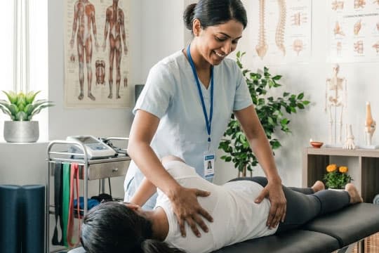 Physiotherapist guiding a patient through a joint mobility exercise